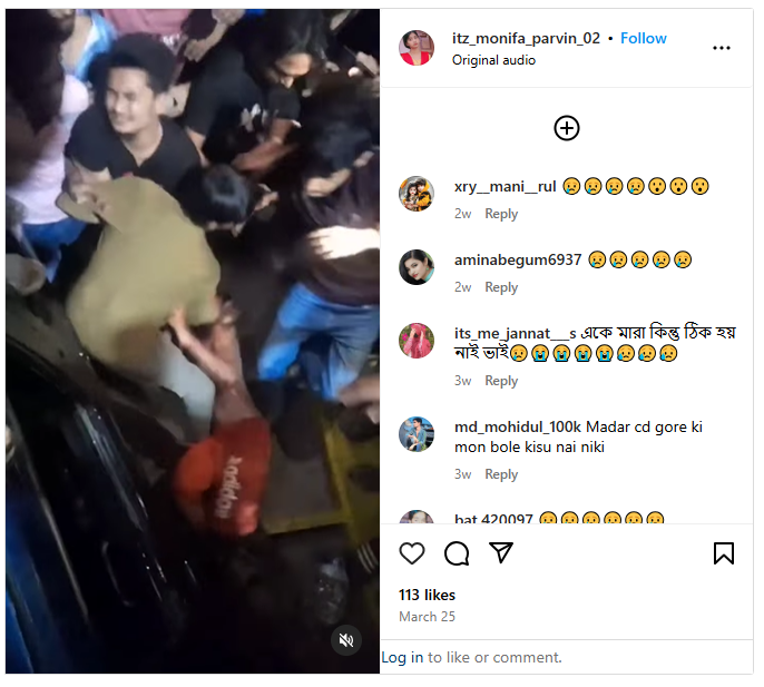 Instagram post by user @itz_monifa_parvin_02 showing a disturbing scene of mob violence where a group of young men are seen surrounding and assaulting another individual on the ground. The victim appears to be in distress, partially restrained, while the attackers—mostly young males—are seen wearing casual clothes, one in a red t-shirt and another in a black shirt. The incident takes place near what seems to be a parked vehicle and a darkened alley or street area, with intense physical altercation visible. The post, dated March 25, has received over 113 likes and numerous emotional reactions and comments in Bengali and Hindi, expressing shock, sadness, and anger. The image is part of a viral video clip that has sparked debates around violence, justice, and youth behavior on social media platforms.