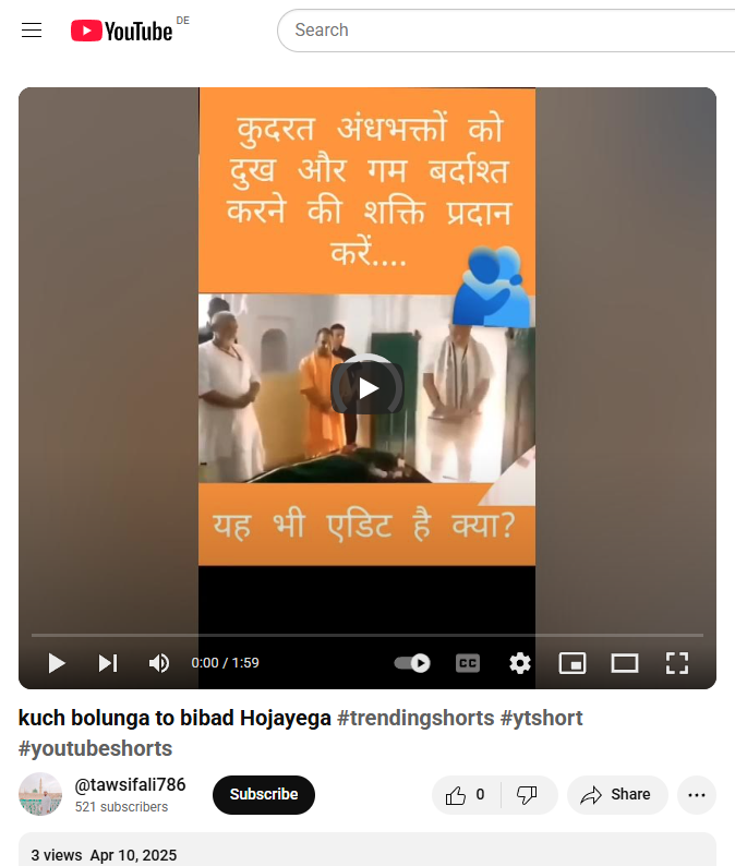 Screenshot of a YouTube Shorts video posted by the channel @tawsifali786, titled 'kuch bolunga to bibad Hojayega' with hashtags #trendingshorts, #ytshort, and #youtubeshorts. The video has 3 views as of April 10, 2025. The video thumbnail features a religious or spiritual setting with several people standing around what appears to be a covered body, possibly indicating a funeral or a moment of silence. Hindi text is overlaid in the thumbnail, saying 'कुदरत अंधभक्तों को दुख और ग़म बर्दाश्त करने की शक्ति प्रदान करें....' (May nature give blind devotees the strength to endure sorrow and grief) and 'यह भी एडिट है क्या?' (Is this also edited?). The video duration is 1 minute and 59 seconds and is shown paused at the beginning. The visual content appears emotionally charged, possibly related to commentary or critique of blind faith or current religious issues in India.