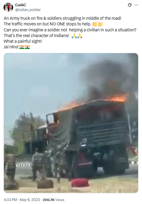 Indian Army truck on fire with soldiers unloading luggage on roadside while traffic passes by; viral 2023 image highlights lack of civilian aid.